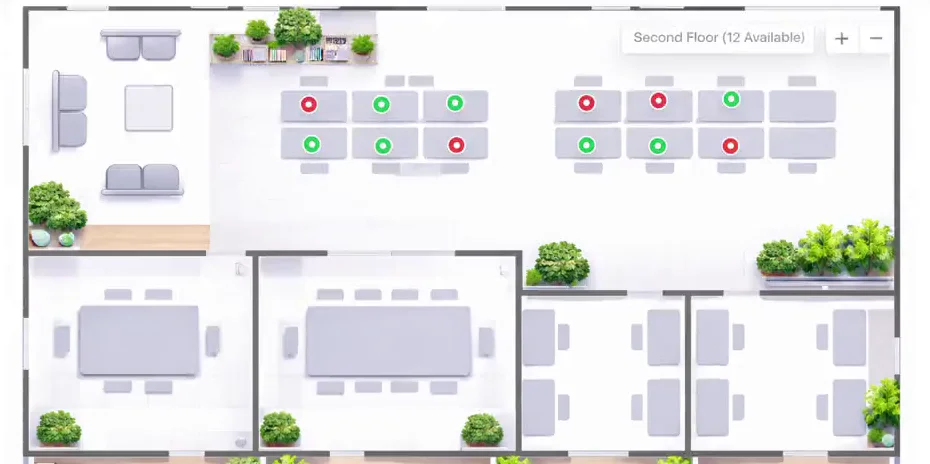 Deskivo’s interactive floor plan: an office layout with desks marked green where free and red where booked, meeting rooms and break areas.